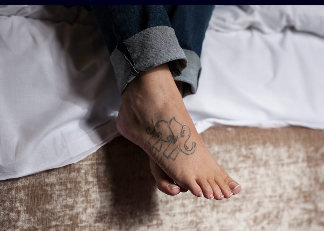 a foot with a tattoo on it