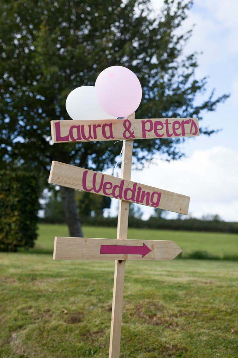 Detailed photograph of sign directing to the wedding